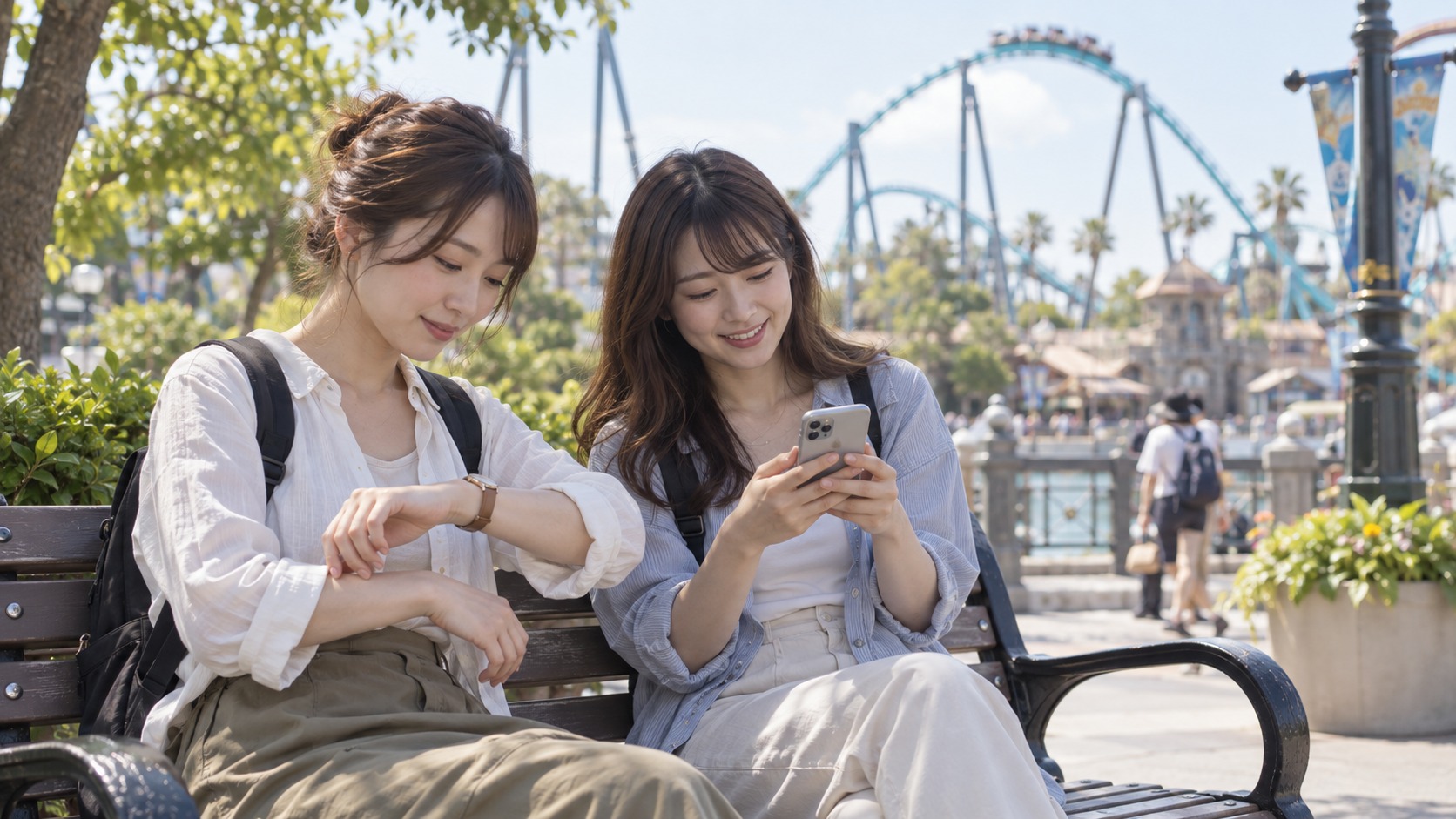 テーマパークで腕時計とスマホを確認する友人同士の実写風イメージ